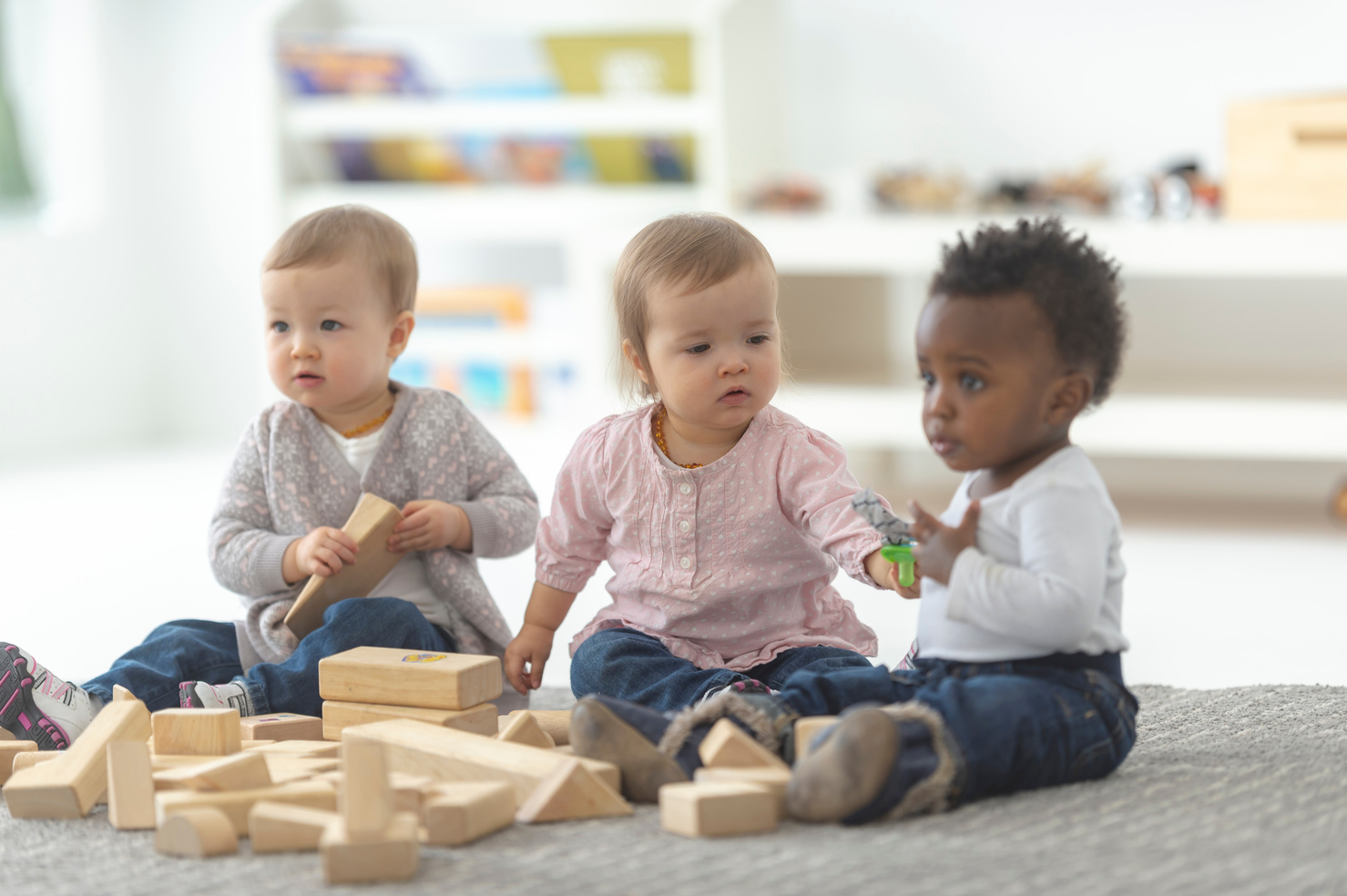 Three toddlers playing